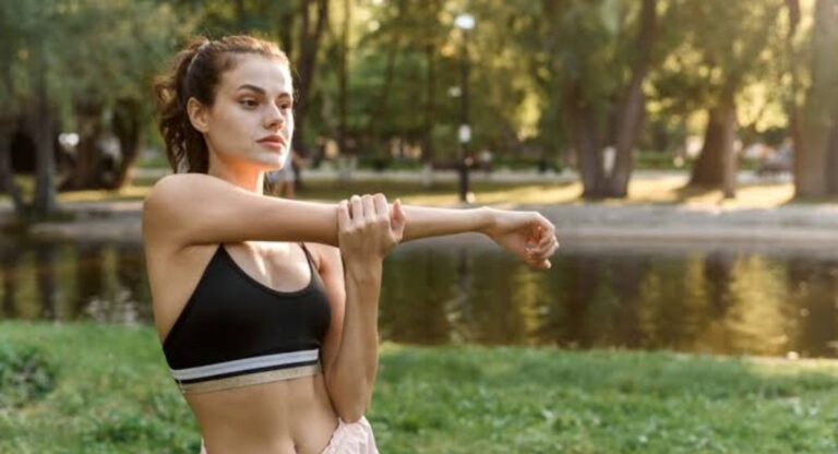 Person tracking weight loss progress while using Zepbound alongside healthy eating, exercise, and regular medical guidance.